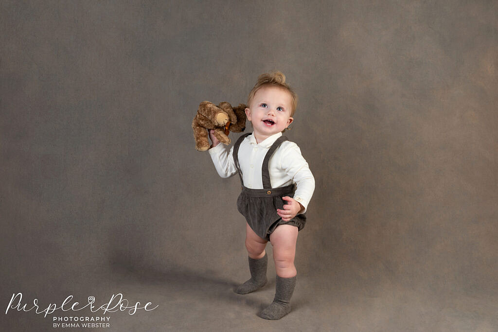 Child playing with a teddy