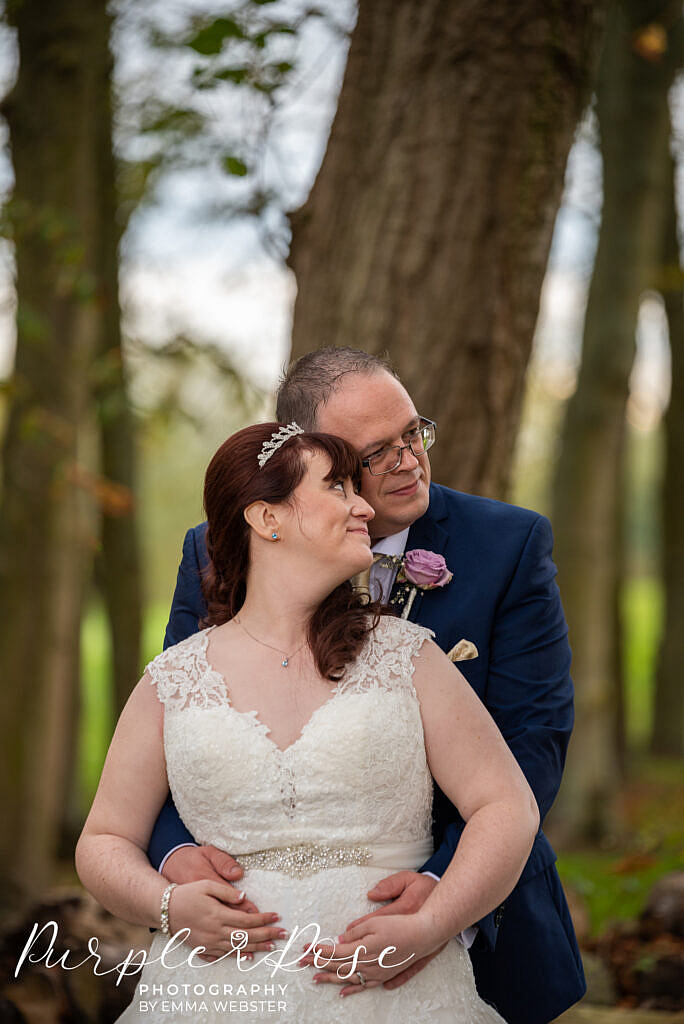 Couple embracing on their wedding day