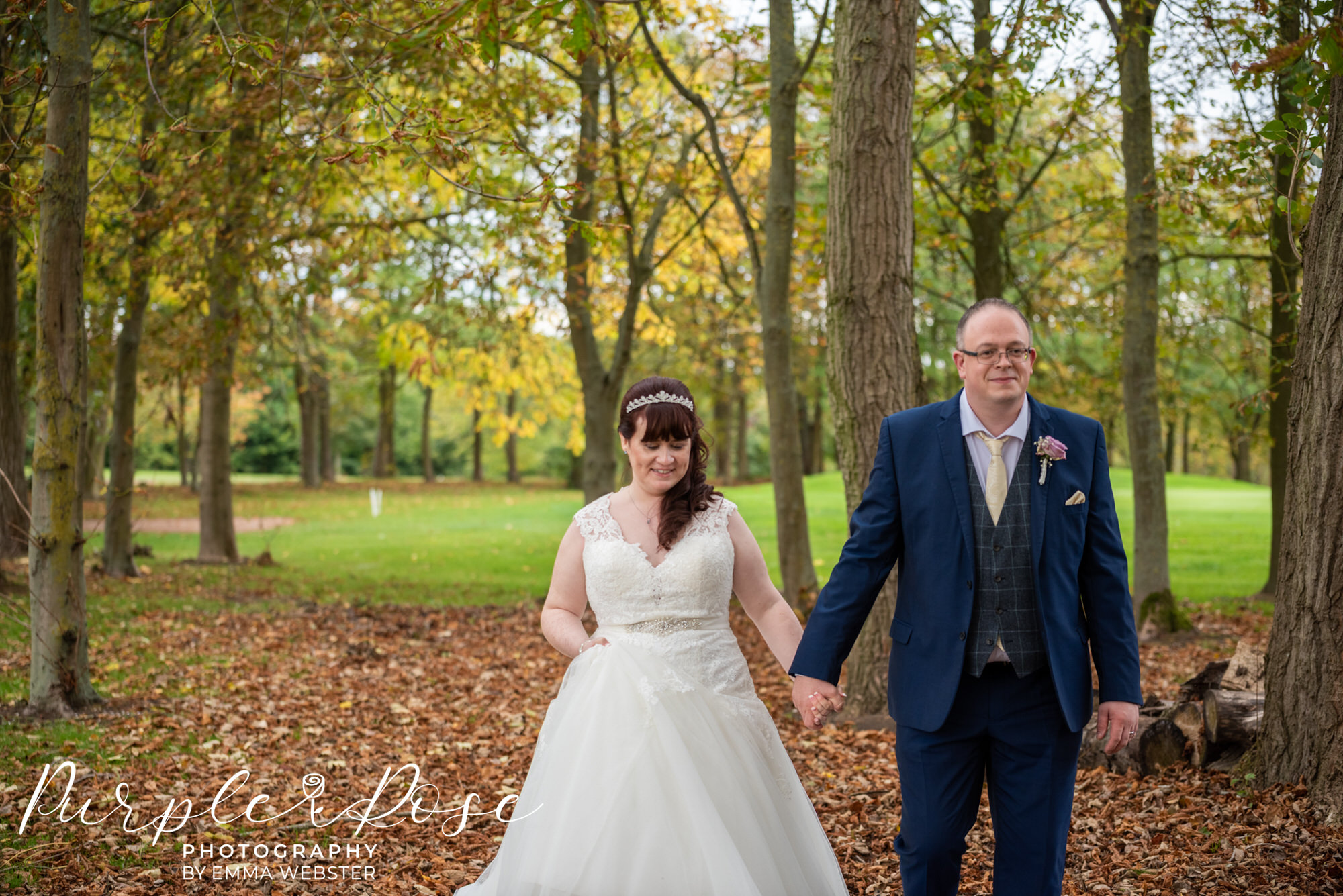 Couple walking during their autum wedding