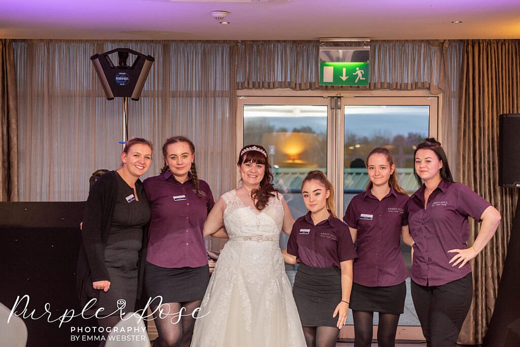 Bride standing with her wedding venues staff