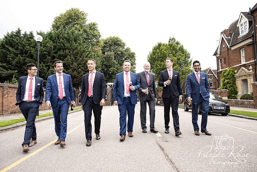 Groomsmen walking to the wedding