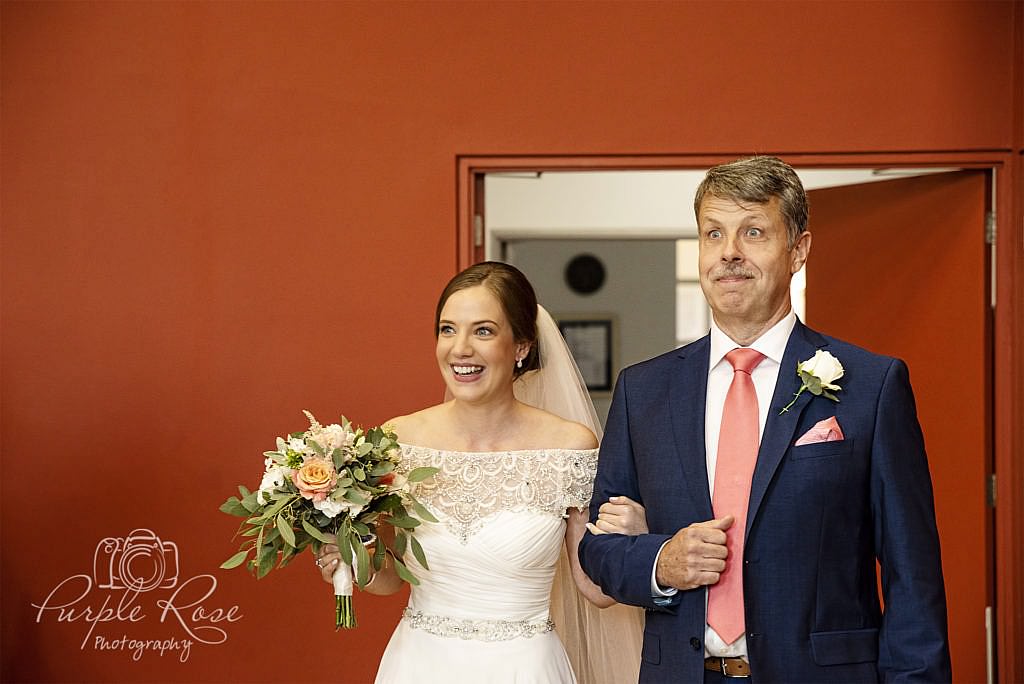 Bride and father of the bride walking into the wedding ceremony