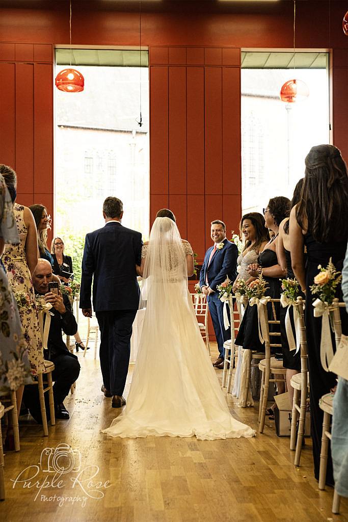 Bride walking to her groom