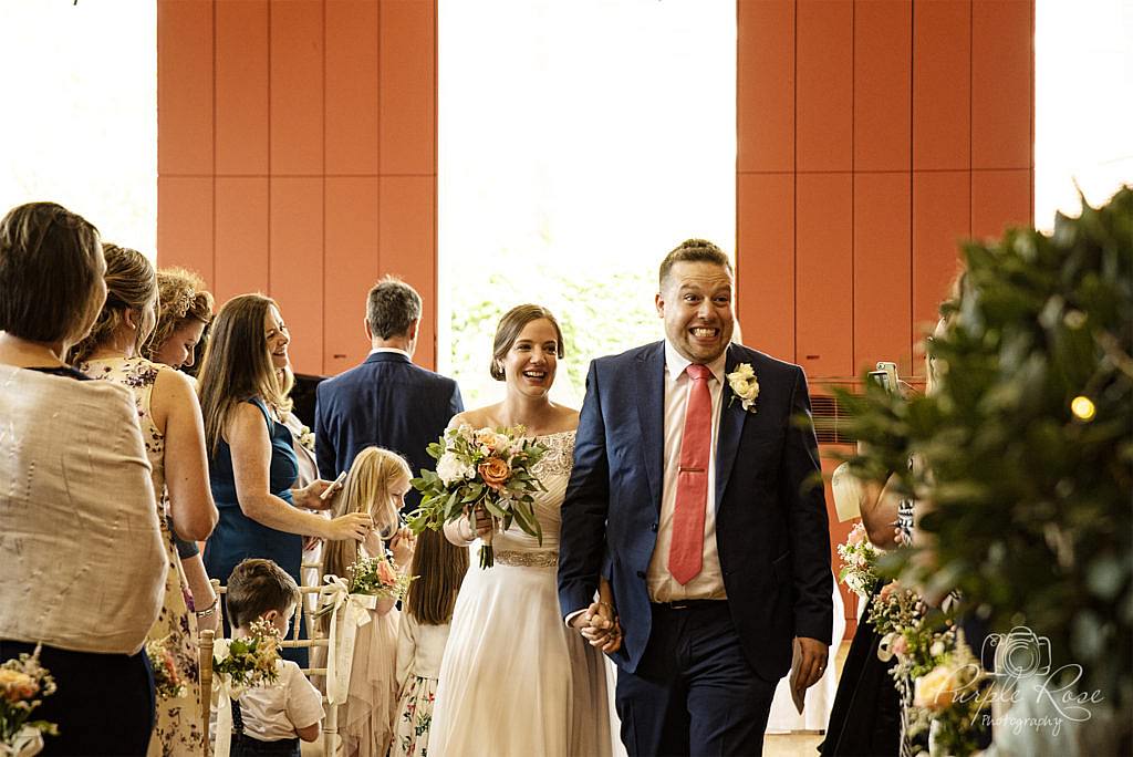 Bride and groom leaving the wedding ceremony