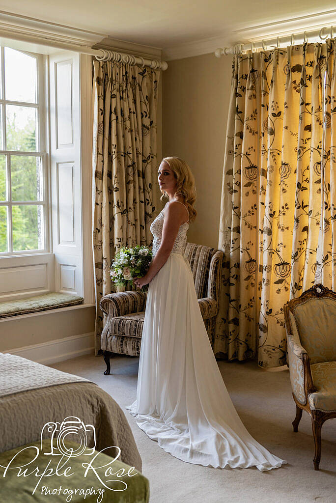 Bride standing in the bridal suite