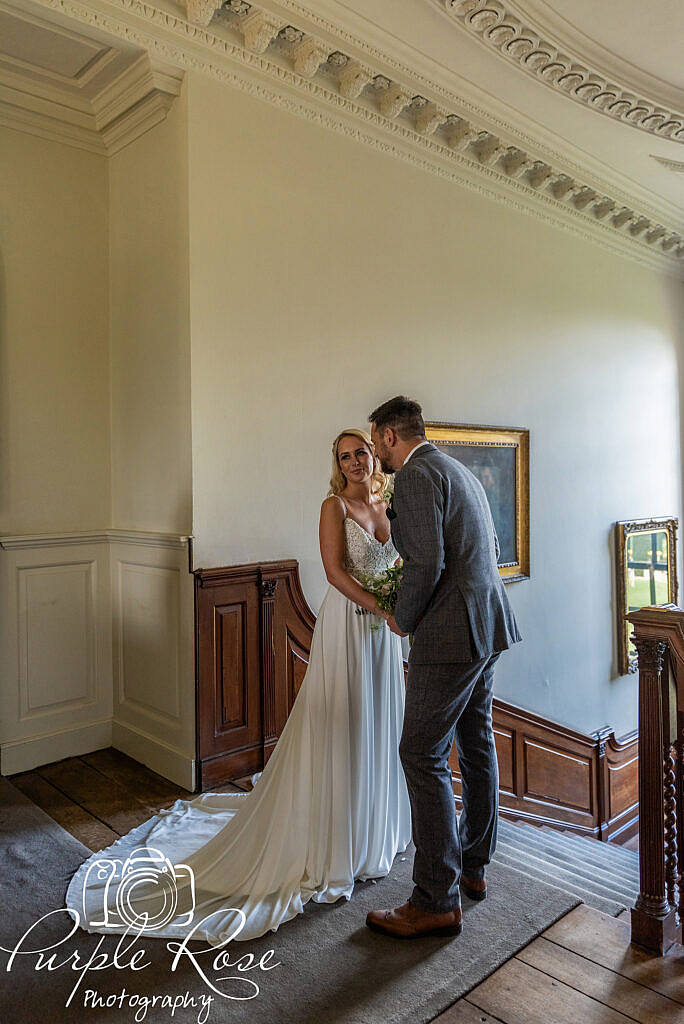 bride and groom on a staircase