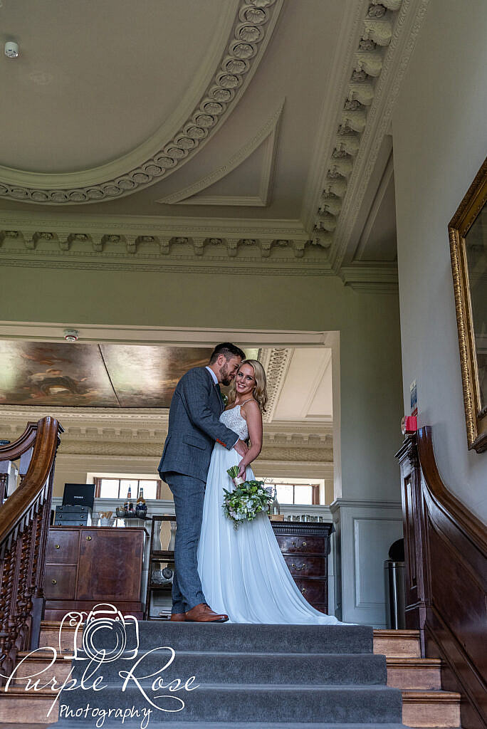 Groom kissing his bride