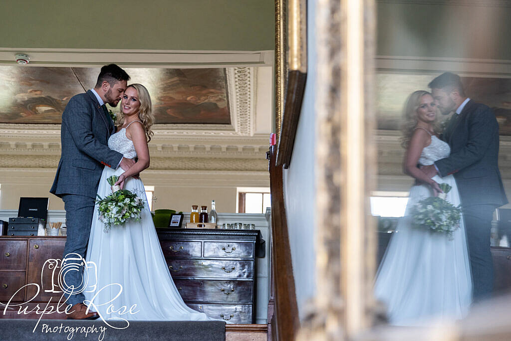 Reflection of bride and groom