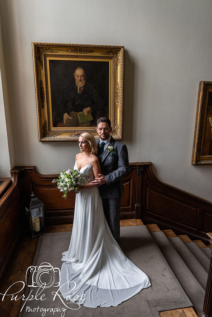 Bride and groom standing on a landing