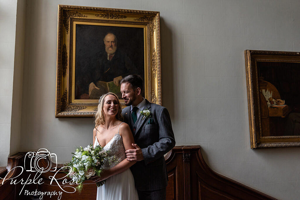 Bride laughing with her husband