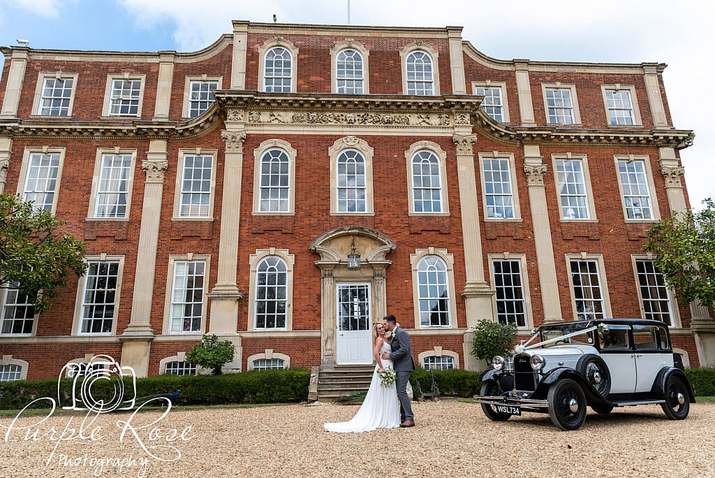 Bride and groom in front of Chicheley Hall