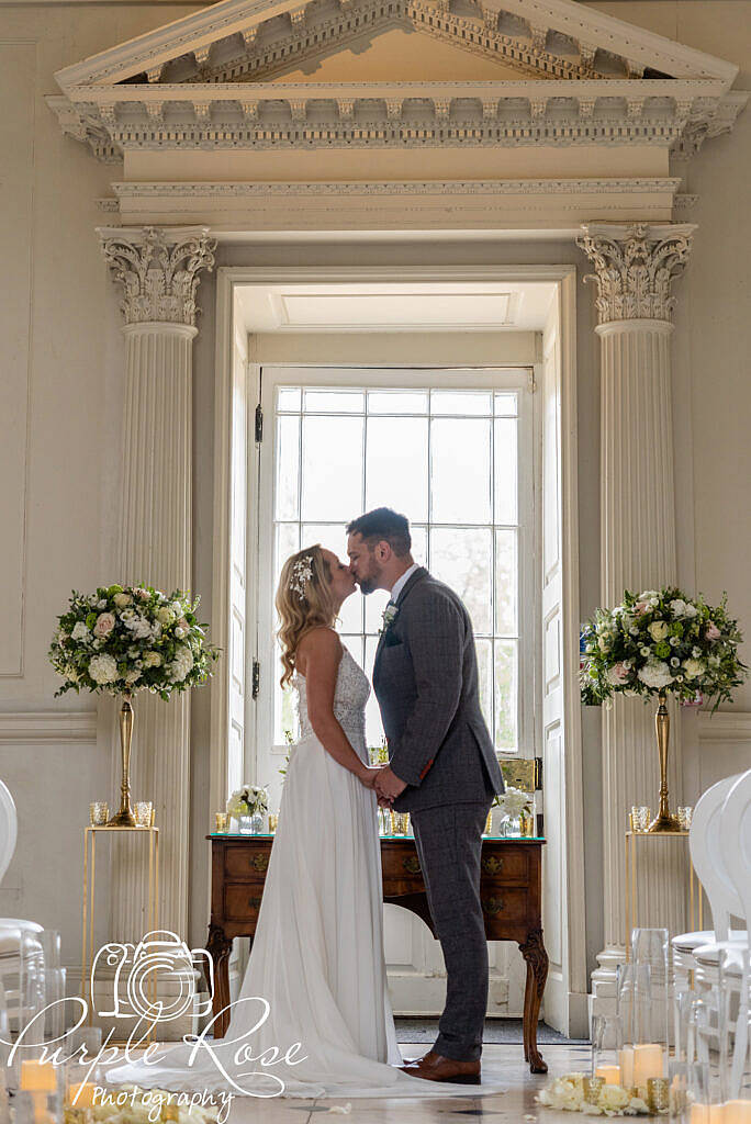 Bride and groom kissing