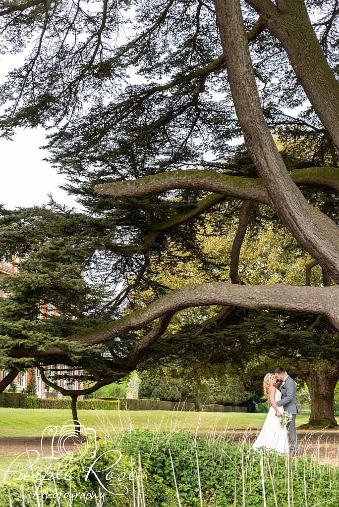 Bride and groom embracing together