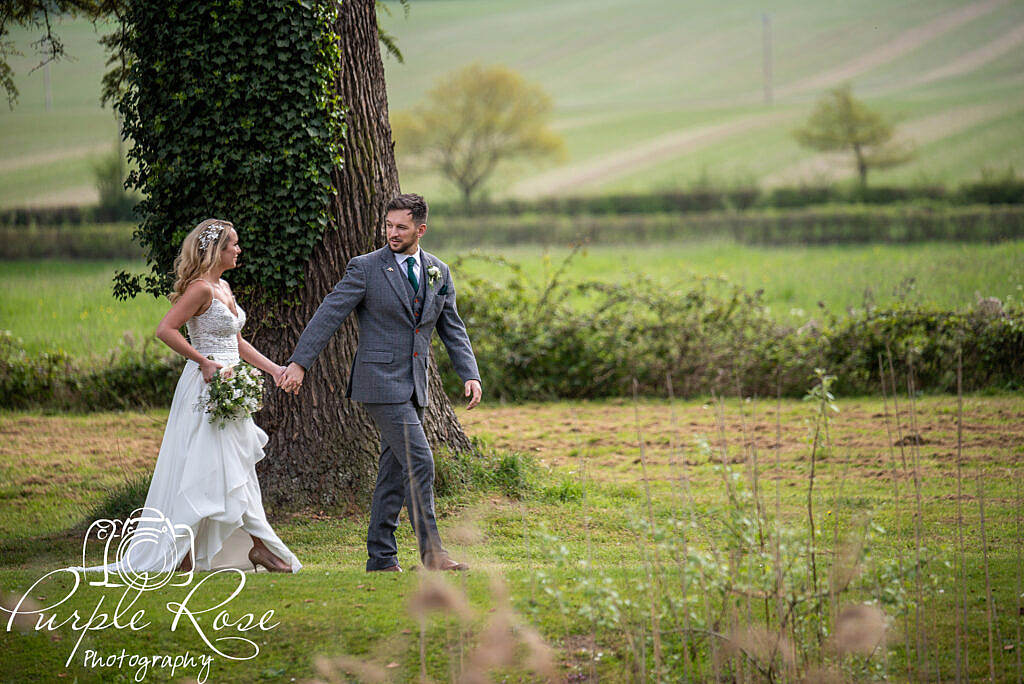 Bride and groom strolling