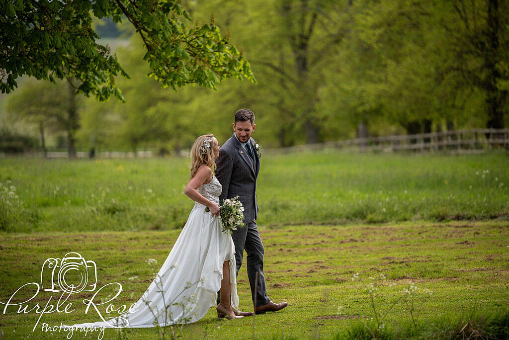 Bride and groom walking and laughing together