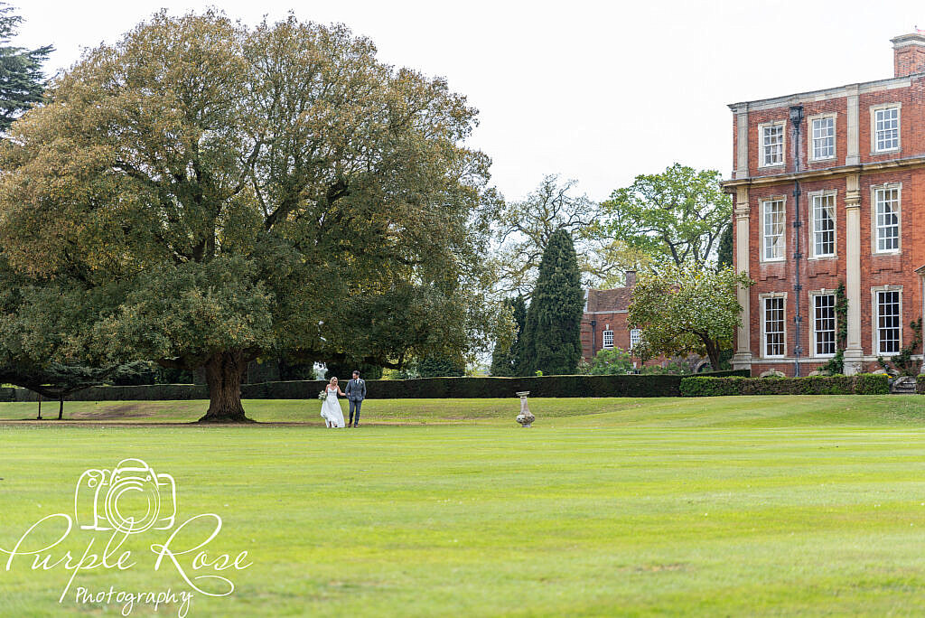 Bride and groom walking around their wedding venue