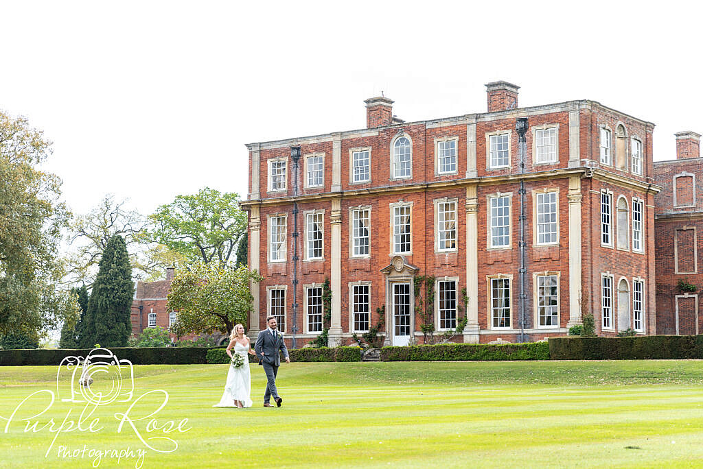 Bride and groom exploring their venues gardens