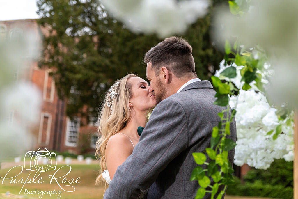 Bride and groom kissing