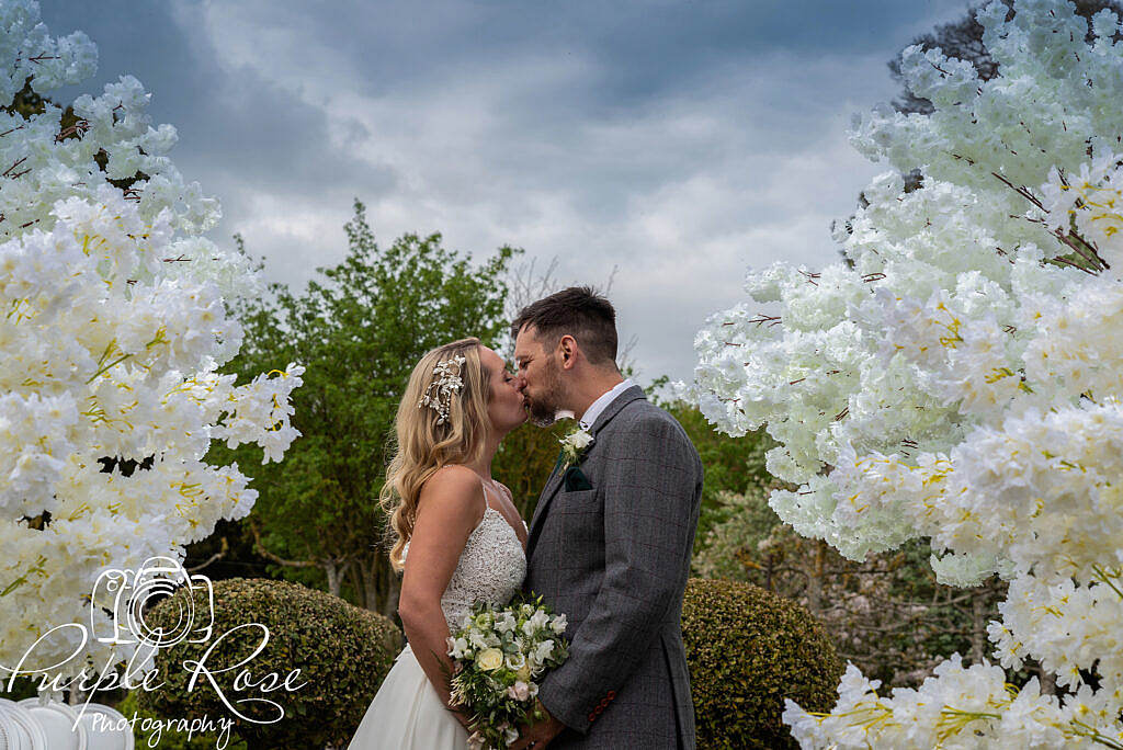 Bride and groom kissing