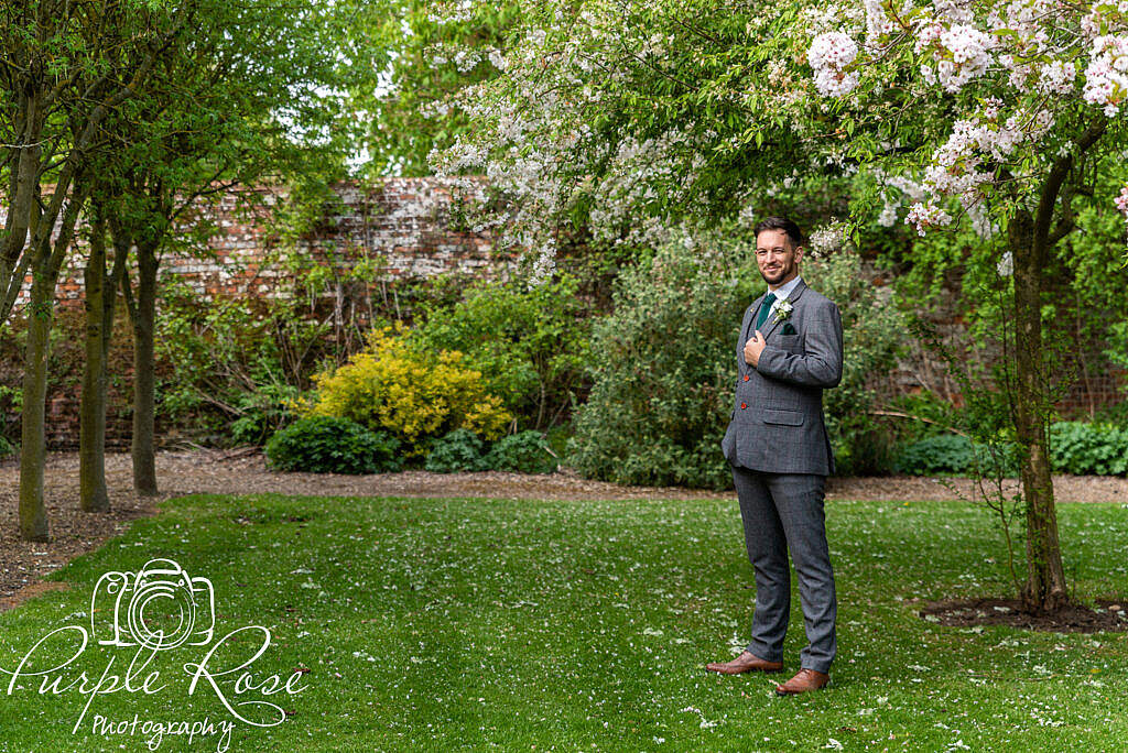 Groom standing alone