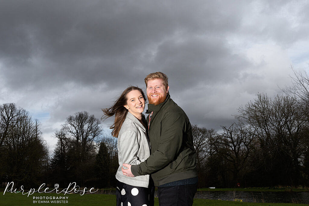 Couple in front of a stormy sky