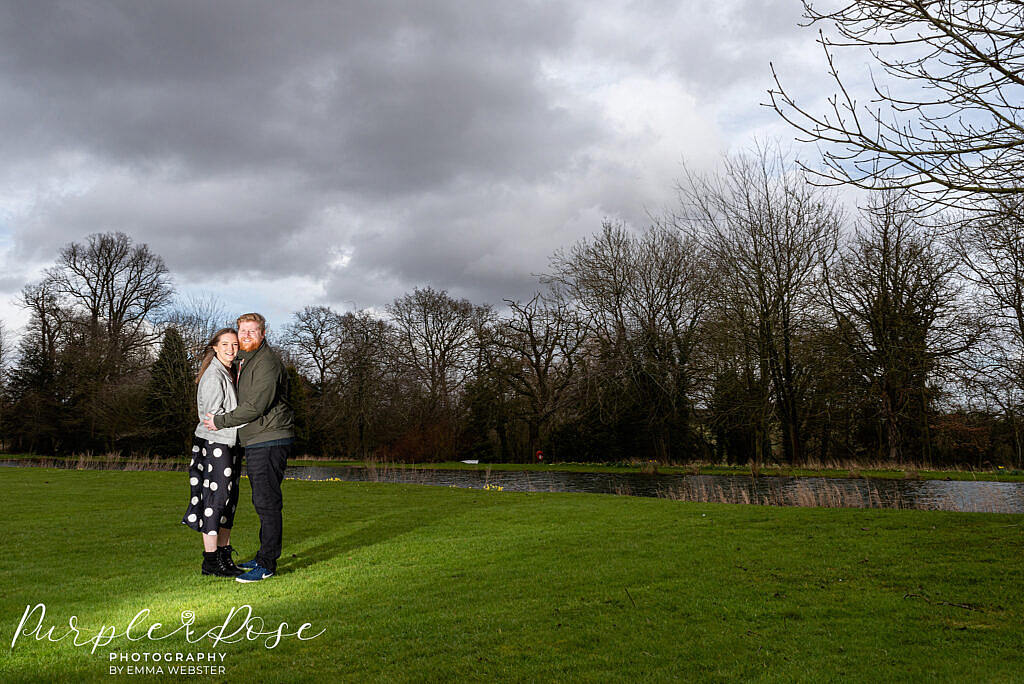 Couple with a dramatic sky behind them