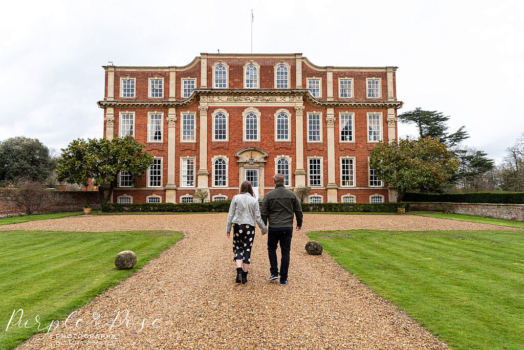 Couple walking towards Chicheley Hall