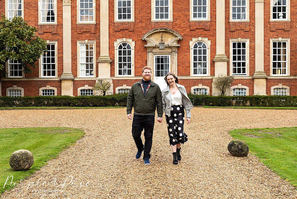 Couple walking away from Chicheley Hall