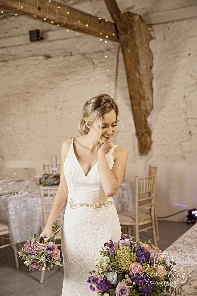 Bride admiring her flowers