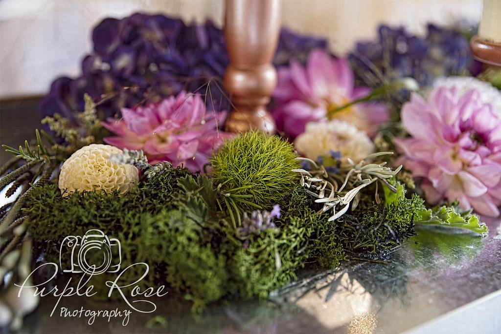 Flowers surrounding wedding cake