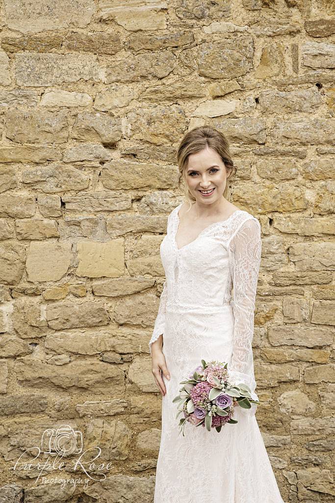 Bride standing outside the barn