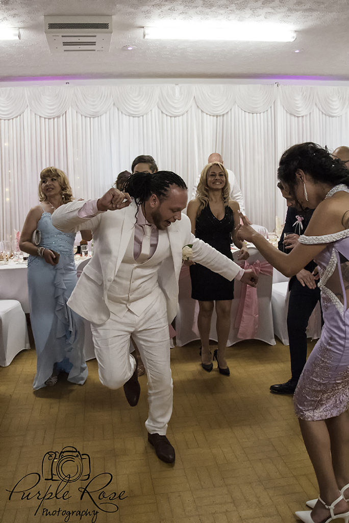 Groom dancing at his wedding reception