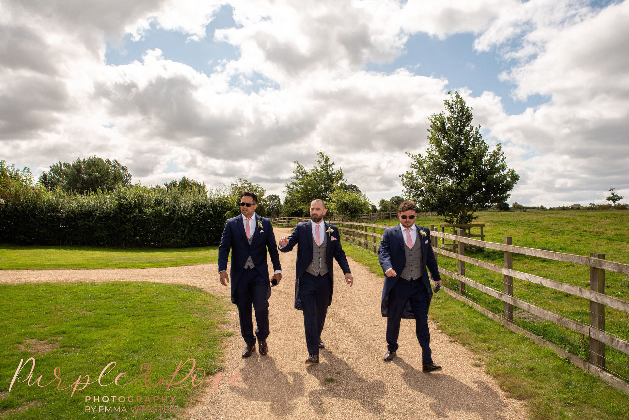 Groom and groomsmen walking to the church