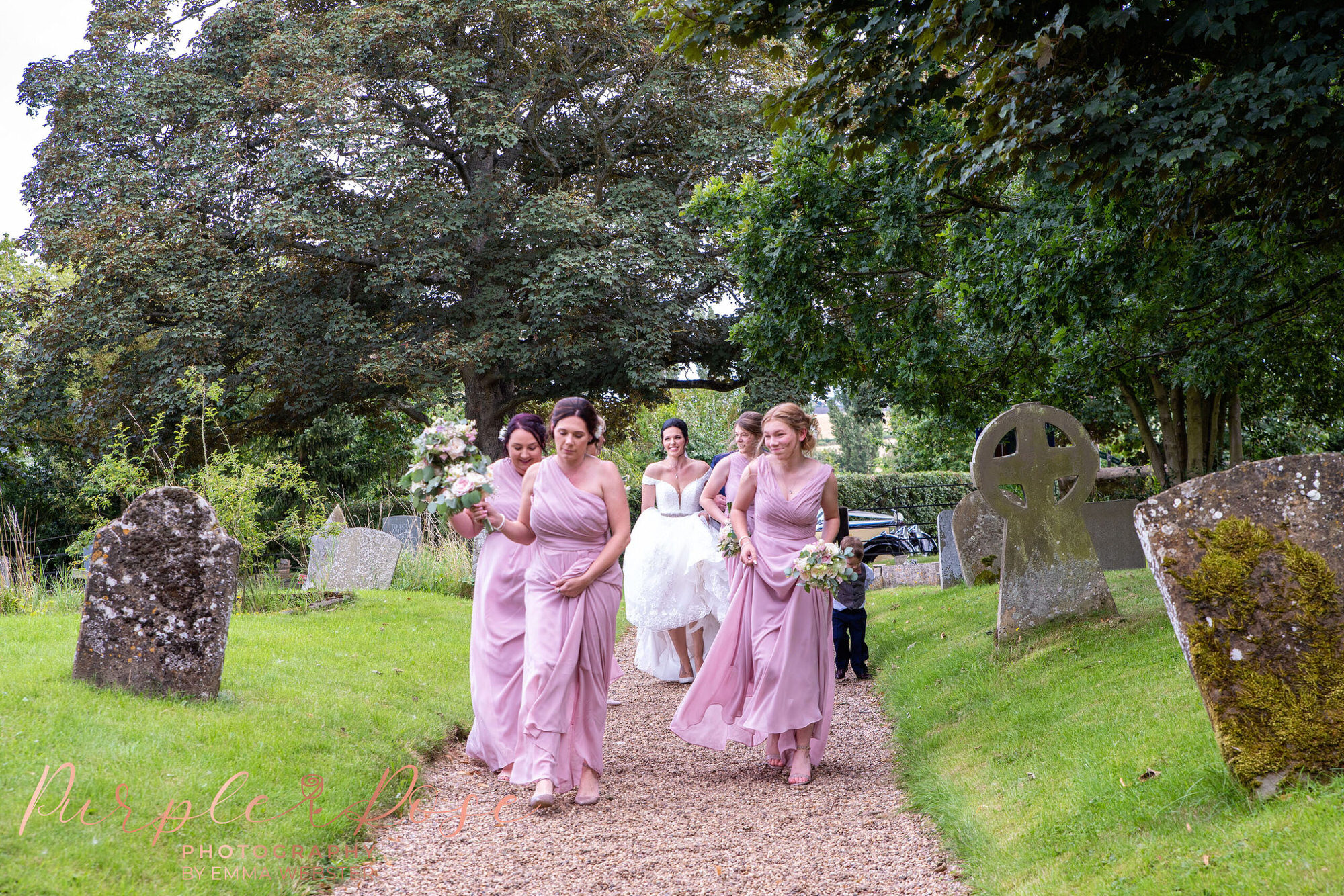 Bride and bridesmaids walking to the church