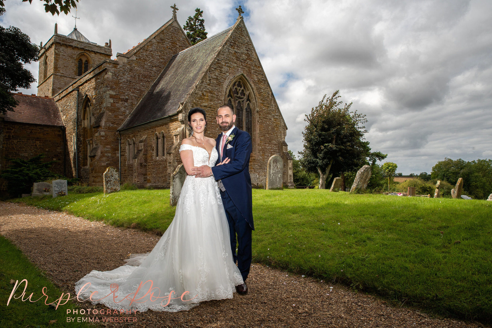 Bride and groom stood outside their church after their wedding
