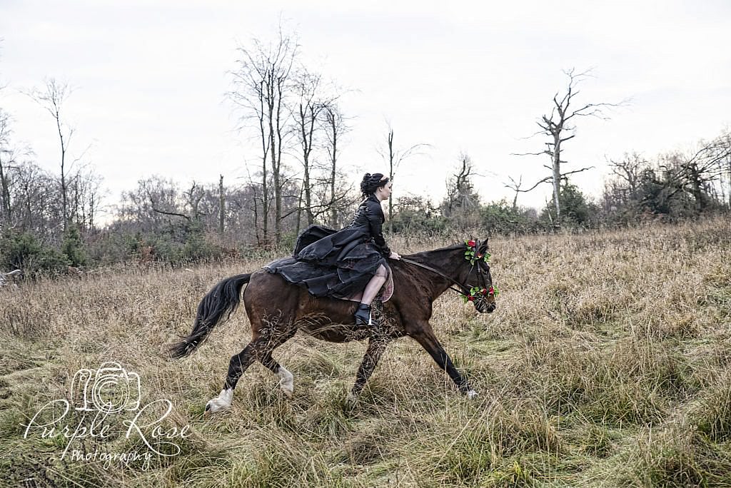 Gothic lady riding a horse