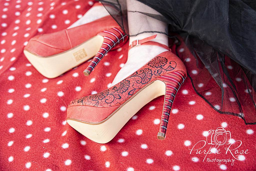 Red hand painted brides shoes