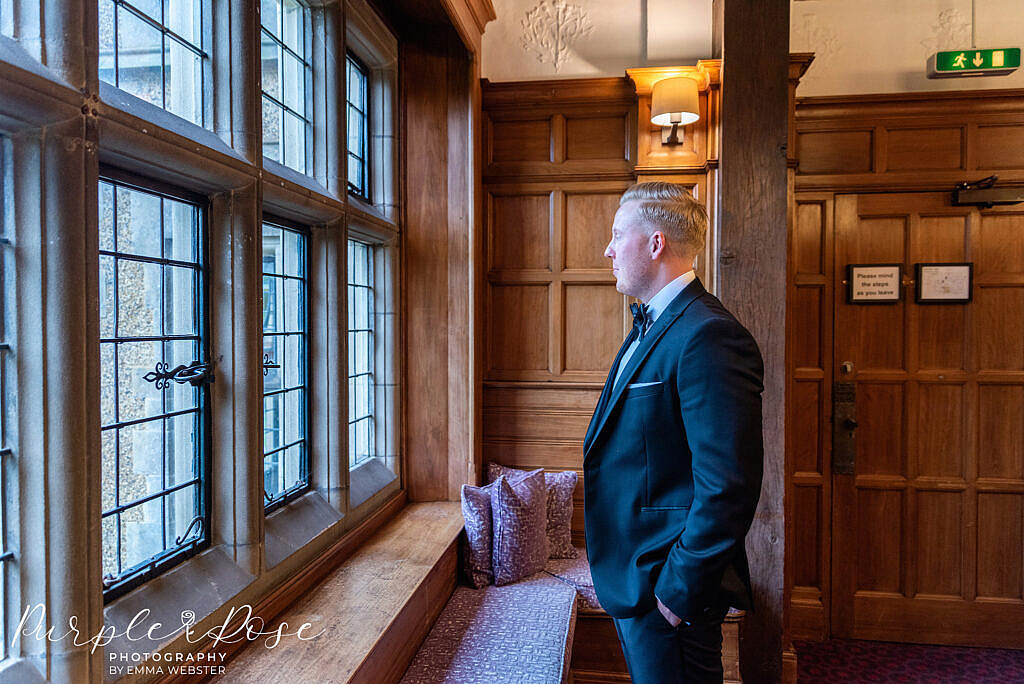 Groom looking out the window