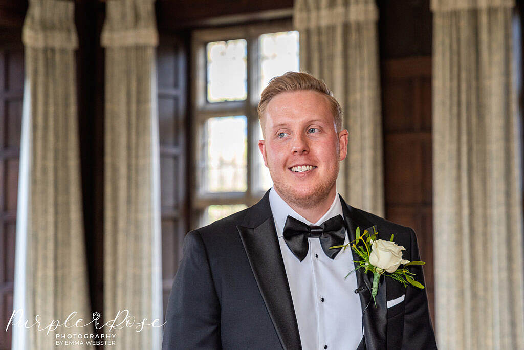 Groom waiting for his bride in the ceremony room