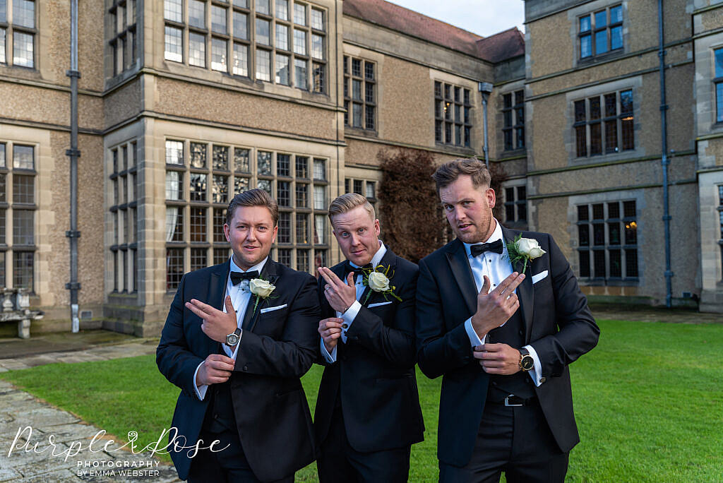 Groom posing with his groomsmen