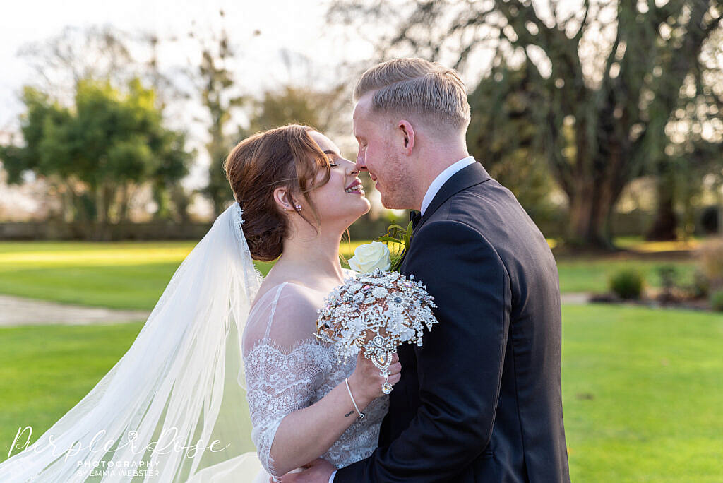 bride and groom looking into each others eyes