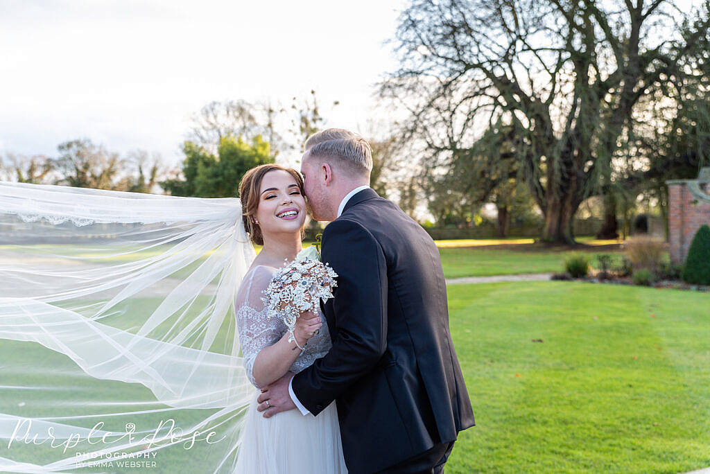 Bride and groom embracing