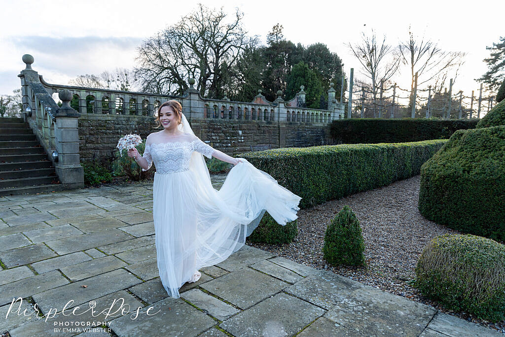 Bride twirling her wedding dress