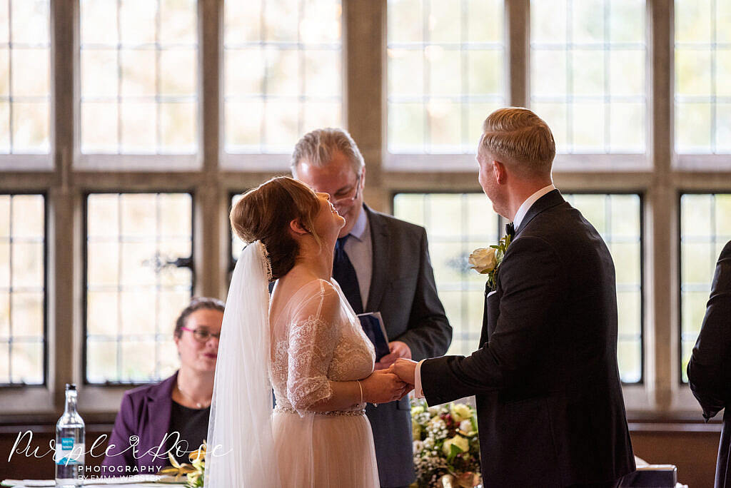 Bride and groom laughing during their wedding ceremony