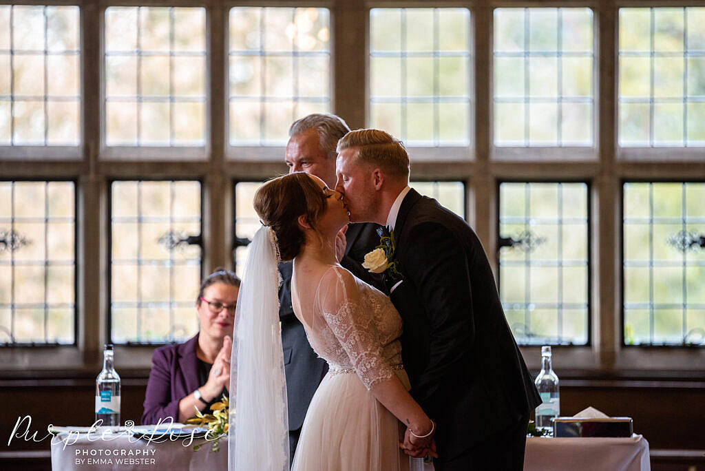 Bride and grooms first kiss
