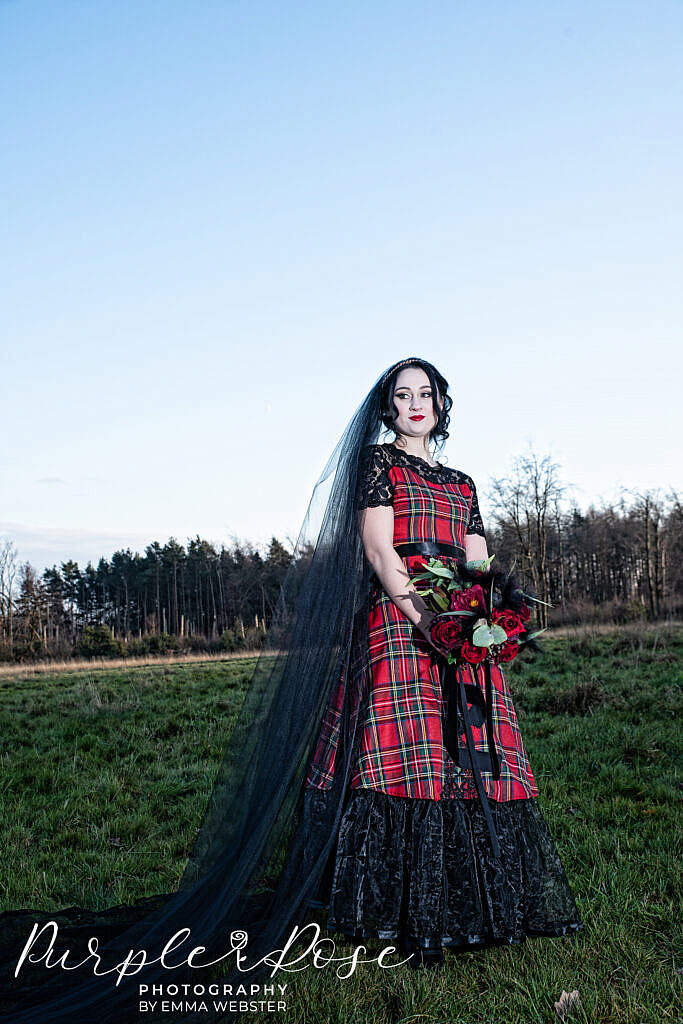 Gothic bride wearing black and red tartan