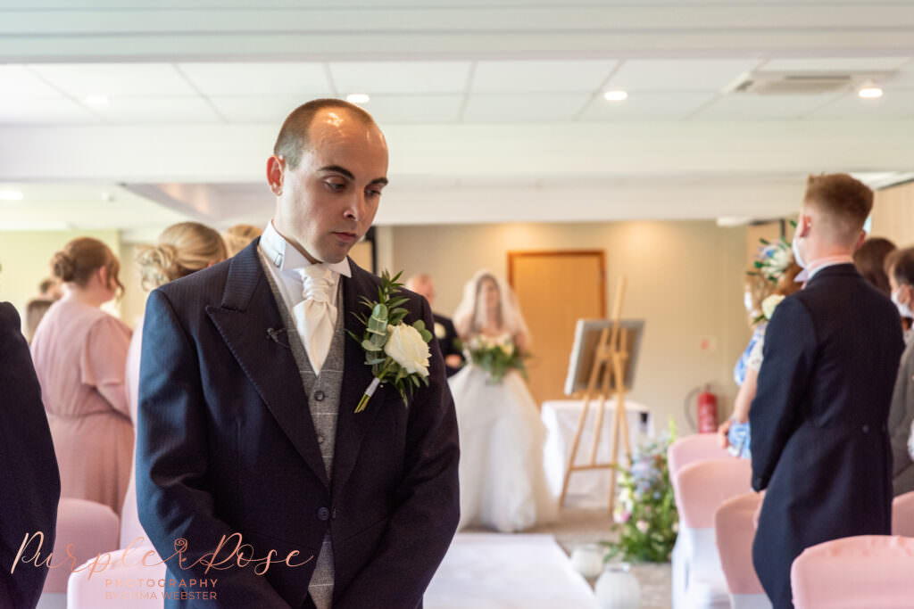 Bride walking towards her groom