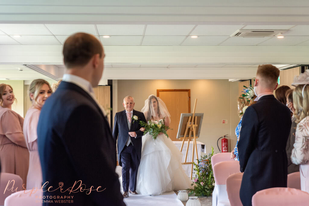 Groom turning to see his brides arrival