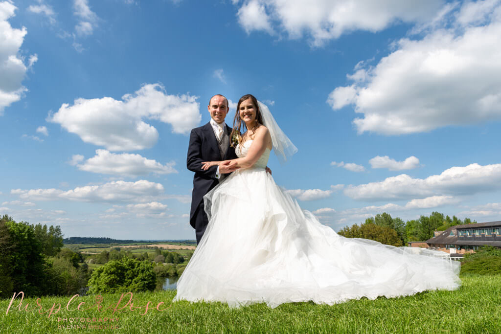 Bride and groom outside on a sunny day