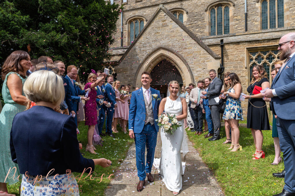 Bride and groom leaving the church after their wedding ceremony